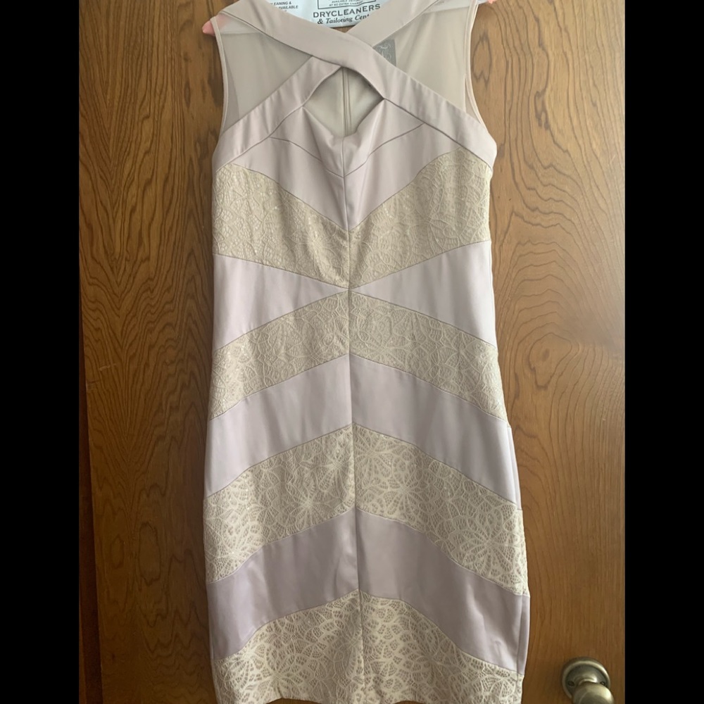 Jax mid length Champaign color dress with lace.